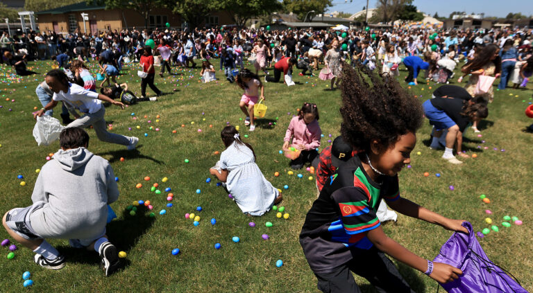 After Promise Center’s Easter services, Sunday, April 20, 2025, at the Sonoma County Fairgrounds in Santa Rosa, kids scramble for their share of 55,000 plastic eggs. (Kent Porter / The Press Democrat)