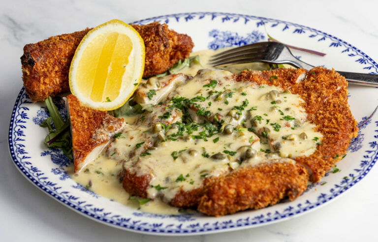 Duroc Pork Chop Milanese with lemon caper butter sauce from Stella Wednesday, March 26, 2025, in Kenwood. (John Burgess / The Press Democrat)