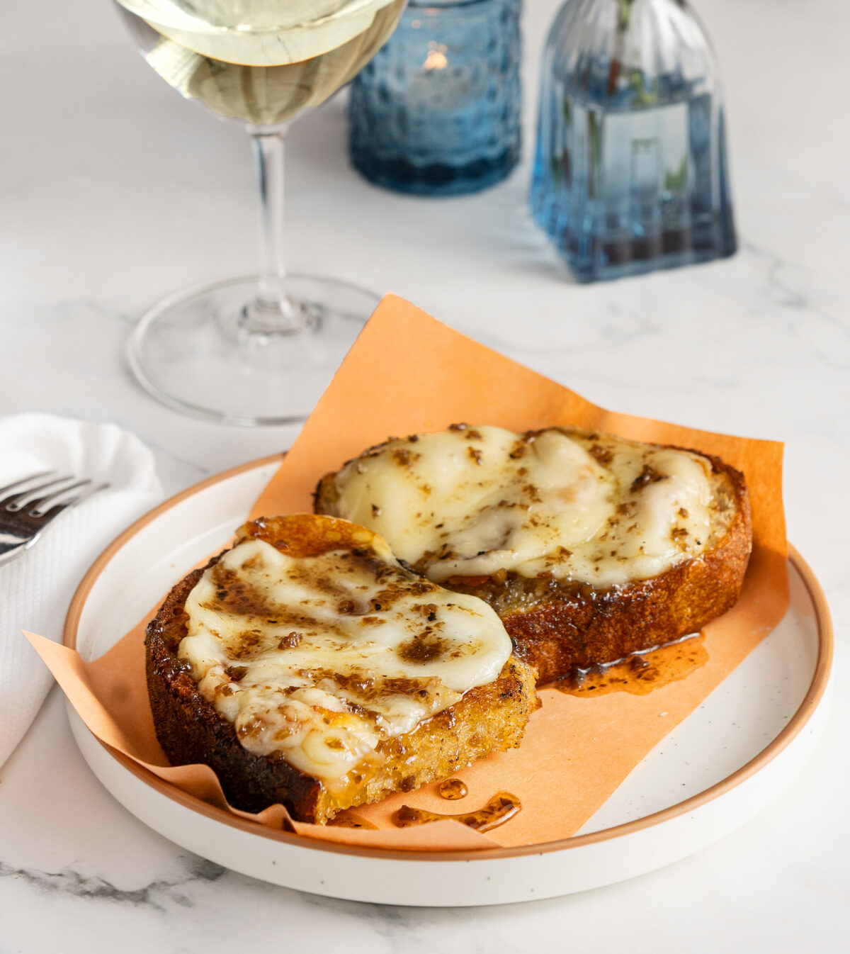 Scamorza Impiccato appetizer with truffle honey and grilled garlic sourdough from Stella Wednesday, March 26, 2025, in Kenwood. (John Burgess / The Press Democrat)