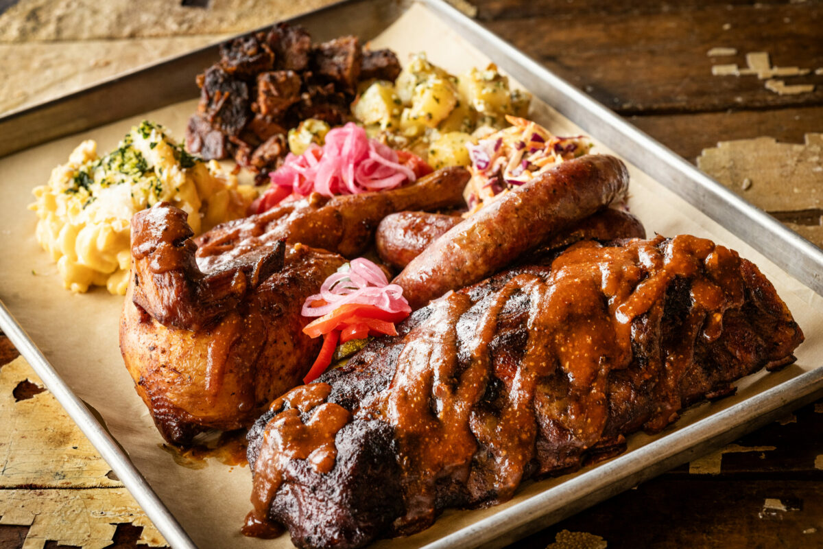 Ribs, chicken, brisket, sausage, burnt ends, mac and cheese, and potato salad with pickled onion from Stateline Road Smokehouse Friday, August 23, 2024, in Napa. (John Burgess / The Press Democrat)