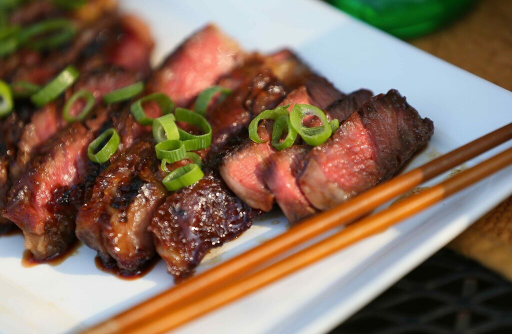 Bachan's grilled rib-eye prepared by Justin Gill. (Christopher Chung/ The Press Democrat)