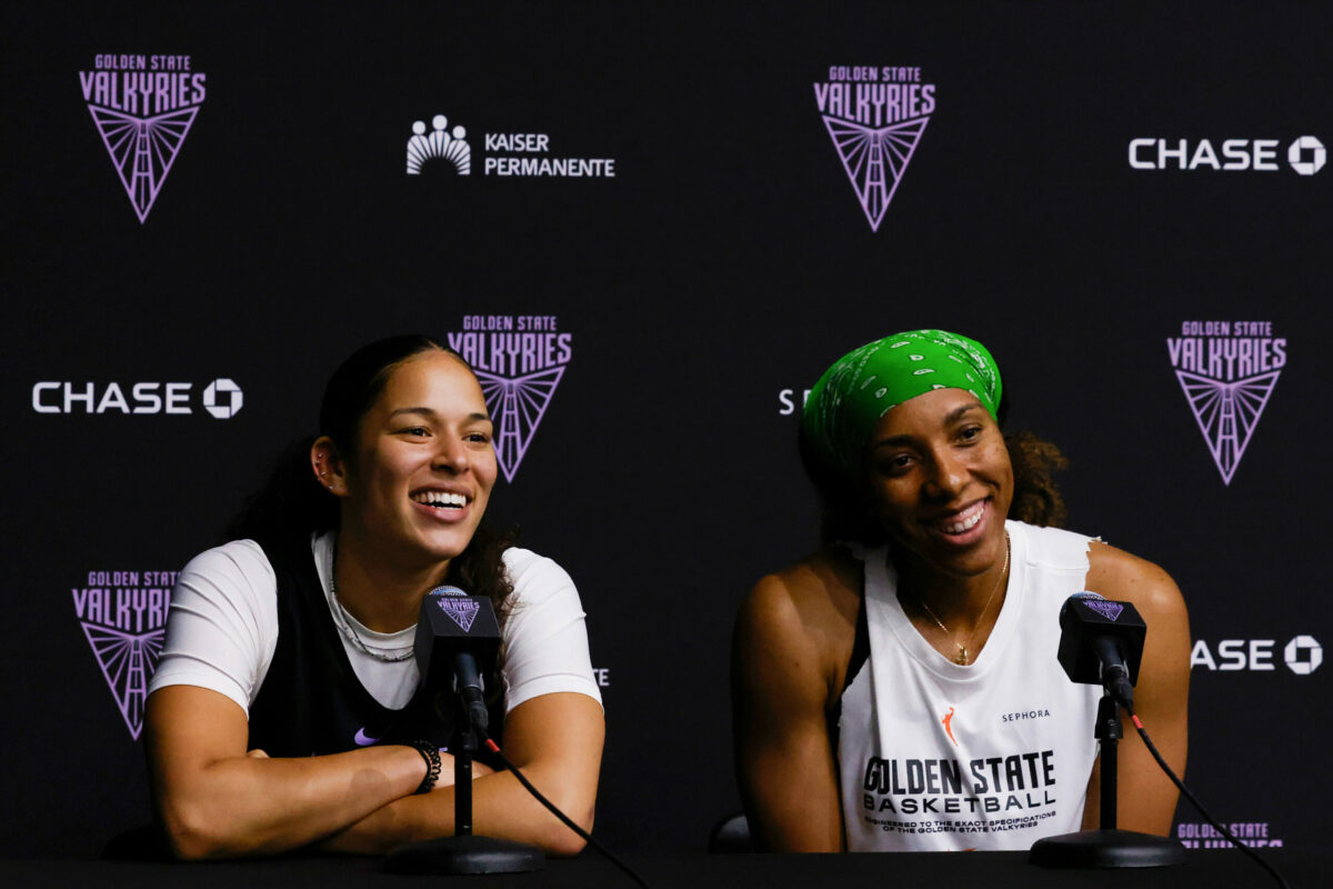 Golden State Valkyries guard Veronica Burton, left, and forward Kayla Thornton laugh as they answer a dancing question about their ability to do so as well as their head coach Natalie Nakase during a Q&A with media post basketball practice in Oakland, Calif. on Thursday, May 8, 2025. (Yalonda M. James/San Francisco Chronicle via AP)