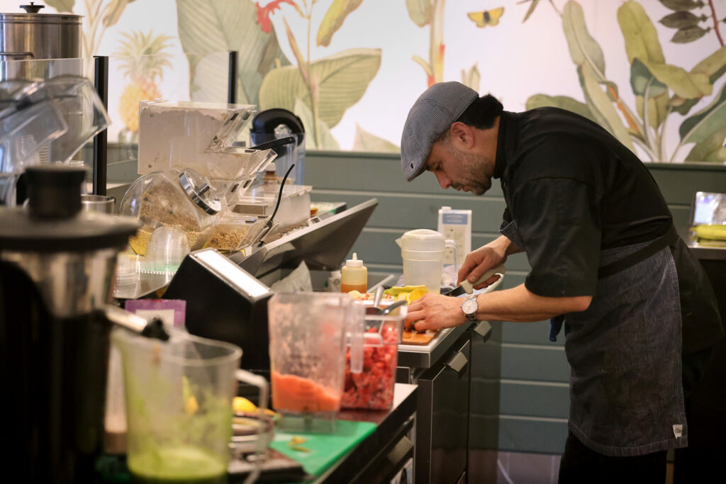 Benjamin Chacon makes a smoothie at Fruity Moto in Windsor Sunday, Jan. 5, 2025. (Beth Schlanker / The Press Democrat)