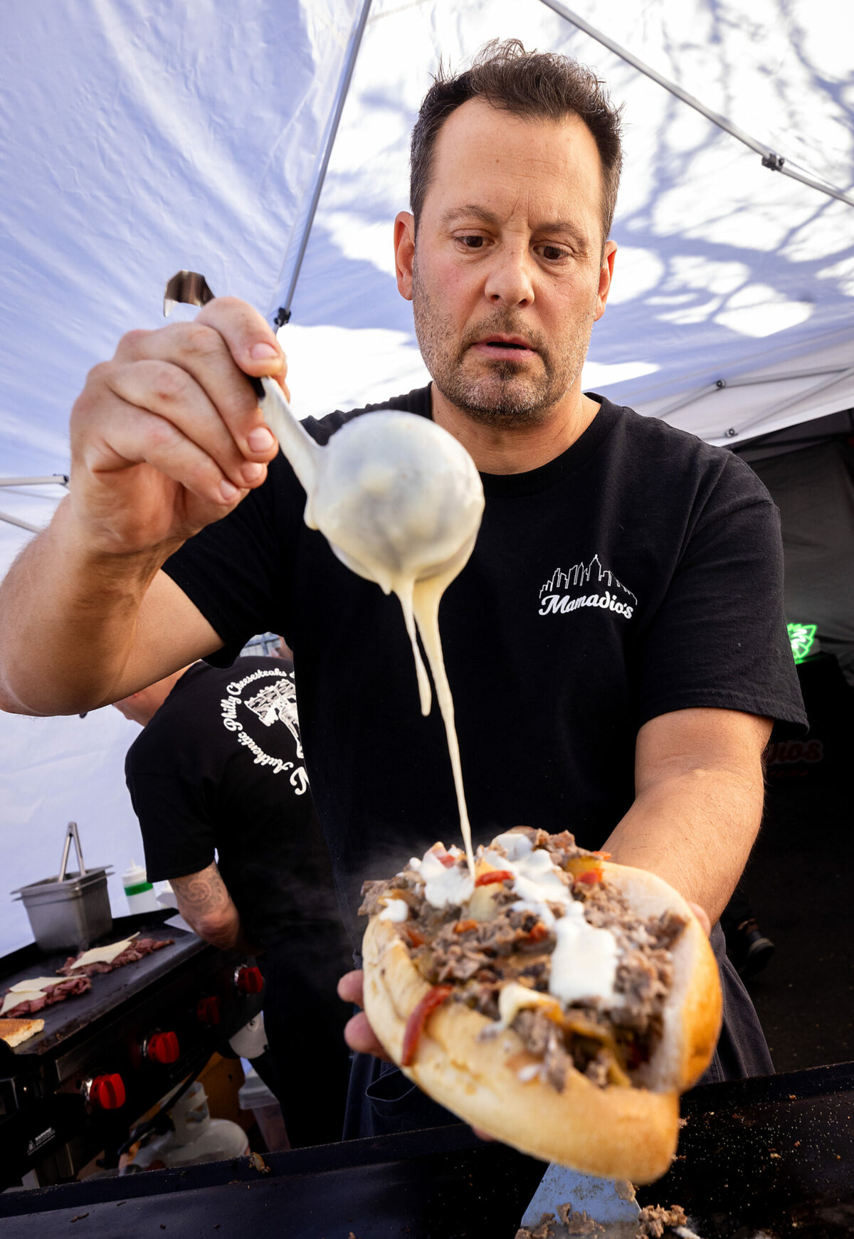 Chris Amadio, owner of Mamadio’s, makes about 200 cheesesteaks on his regular Friday night, March 7, 2025, pop-up at Parliament Brewing Co. in Rohnert Park. (John Burgess / The Press Democrat)