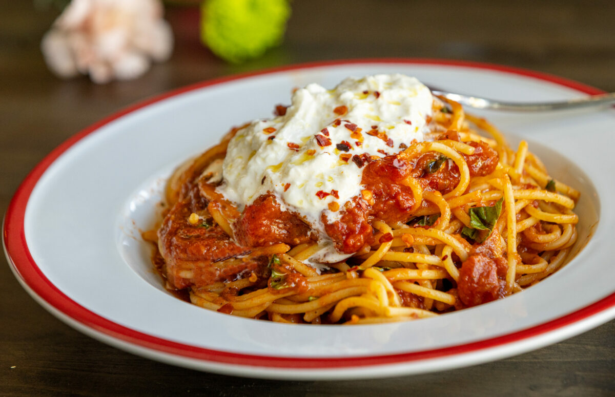 Spaghetti & Sunday Red Sauce with roasted onion, garlic, basil and San Marzano tomatoes from Acre Pasta, Friday, May 30, 2025, in Sebastopol’s Barlow District. (John Burgess / The Press Democrat)
