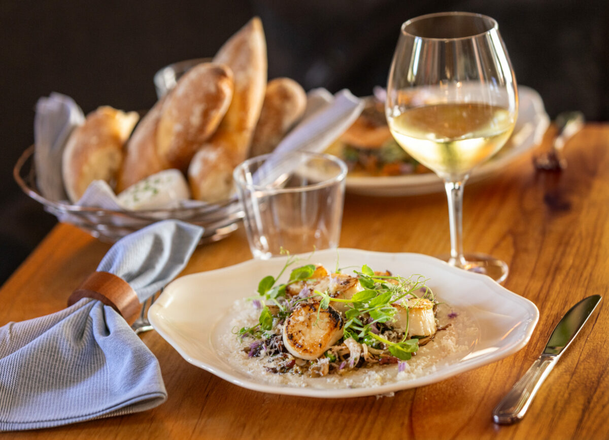 Coquilles St, Jaques Scallops with pork rillons, comté, mushrooms, english peas, spring onionsd and pastis from Poppy restaurant Thursday, June 12, 2025, in Glen Ellen. (John Burgess / The Press Democrat)