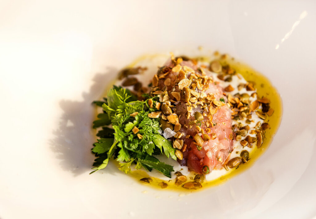 Poisson Cru Frais, a kampachi tartare, chili-citrus crema and fried pumpkin seeds from Poppy restaurant Thursday, June 12, 2025, in Glen Ellen. (John Burgess / The Press Democrat)