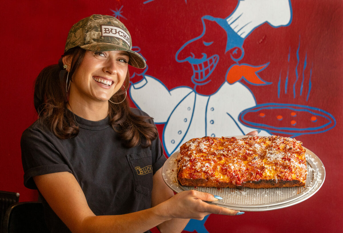 Server Mercedes DeWitt with the Buck’s Original (thick, upside down) Pan Pie with Pepperoni from Buck’s Place Friday, July 19, 2024, in Sonoma. (John Burgess/The Press Democrat)