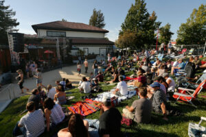 Visitors lounge on the amphitheatre lawn before the evening's concert at Lagunitas Brewing Company in Petaluma on Tuesday, August 9, 2016. (Alvin Jornada / The Press Democrat)