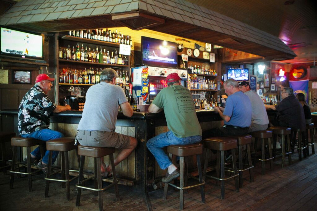 An early afternoon crowd at the Penngrove Pub came for games and conversations as bartender Dirk Payne served up drinks. (Crissy Pascual / Petaluma Argus-Courier)