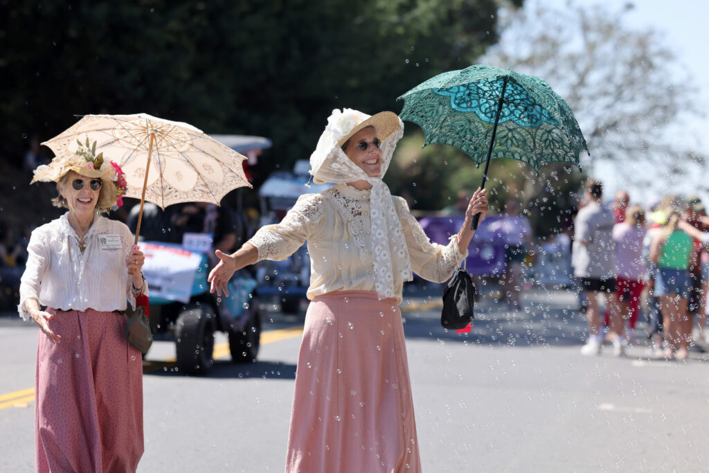 Leslie Scatchard, center, with the group Petalumans of Yesteryear walks dressed as the late Sarah Frances Cassiday 1866-1935, during the 48th annual Penngrove parade in Penngrove, Sunday, July 7, 2024. (Beth Schlanker / The Press Democrat)