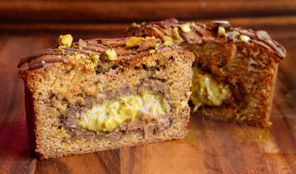 The newly famous “I need Dubai this Cookie” with a browned butter, pistachio and chocolate cookie with a Dubai Chocolate Bon Bon baked into the center from Odd Cookie owner Anna Rodriguez Friday, May 8, 2025, in Penngrove. (John Burgess / The Press Democrat)