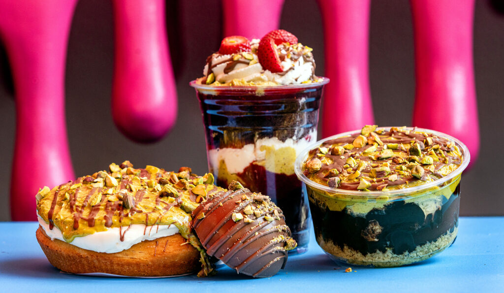 Odd Cookie owner Anna Rodriguez makes five different Dubai Chocolate treats including, from left, Cinnamon Roll, a Bon Bon filled with toasted kataifi and pistachio cream, Cake Cup with strawberries, chocolate pudding , pistachio and whipped cream and a Parfait Friday, May 8, 2025, in Penngrove. (John Burgess / The Press Democrat)