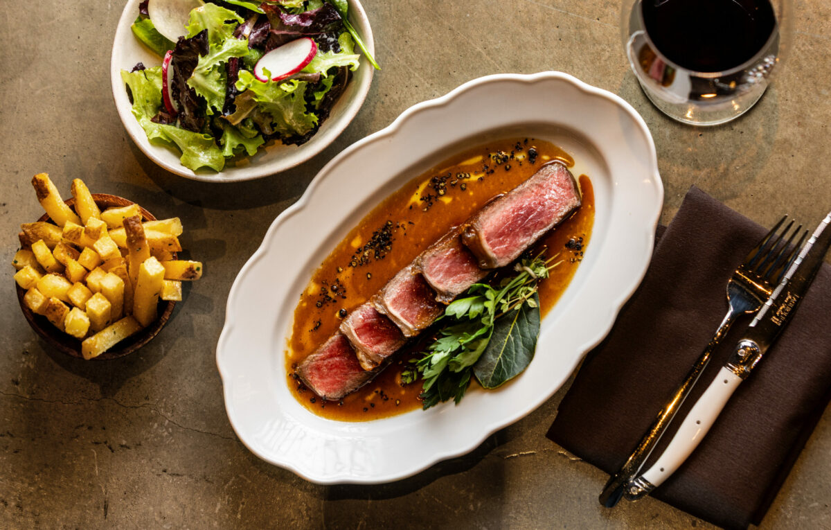 Steak & Frites with sauce au Poivre, beef jus and garden salad from Bijou, the new Petaluma restaurant from chef Stéphane Saint Louis Monday, July 1, 2025. (John Burgess / The Press Democrat)