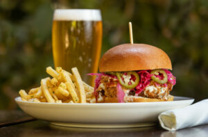 Fried Chicken Sandwich with spicy pickled slaw, jalapeños, ranch, hot sauce and fries from The Burrow Wednesday, July 9, 2025 just off the square in Healdsburg. (John Burgess / Press Democrat)