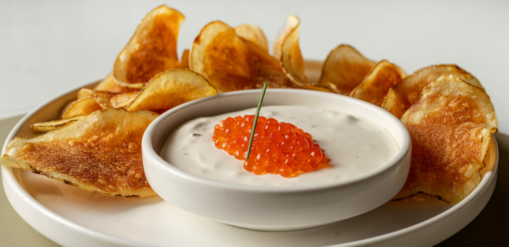 Crisps and Dip with smoked salmon whipped creme fraiche topped with roe from The Burrow Wednesday, July 9, 2025 just off the square in Healdsburg. (John Burgess / The Press Democrat)