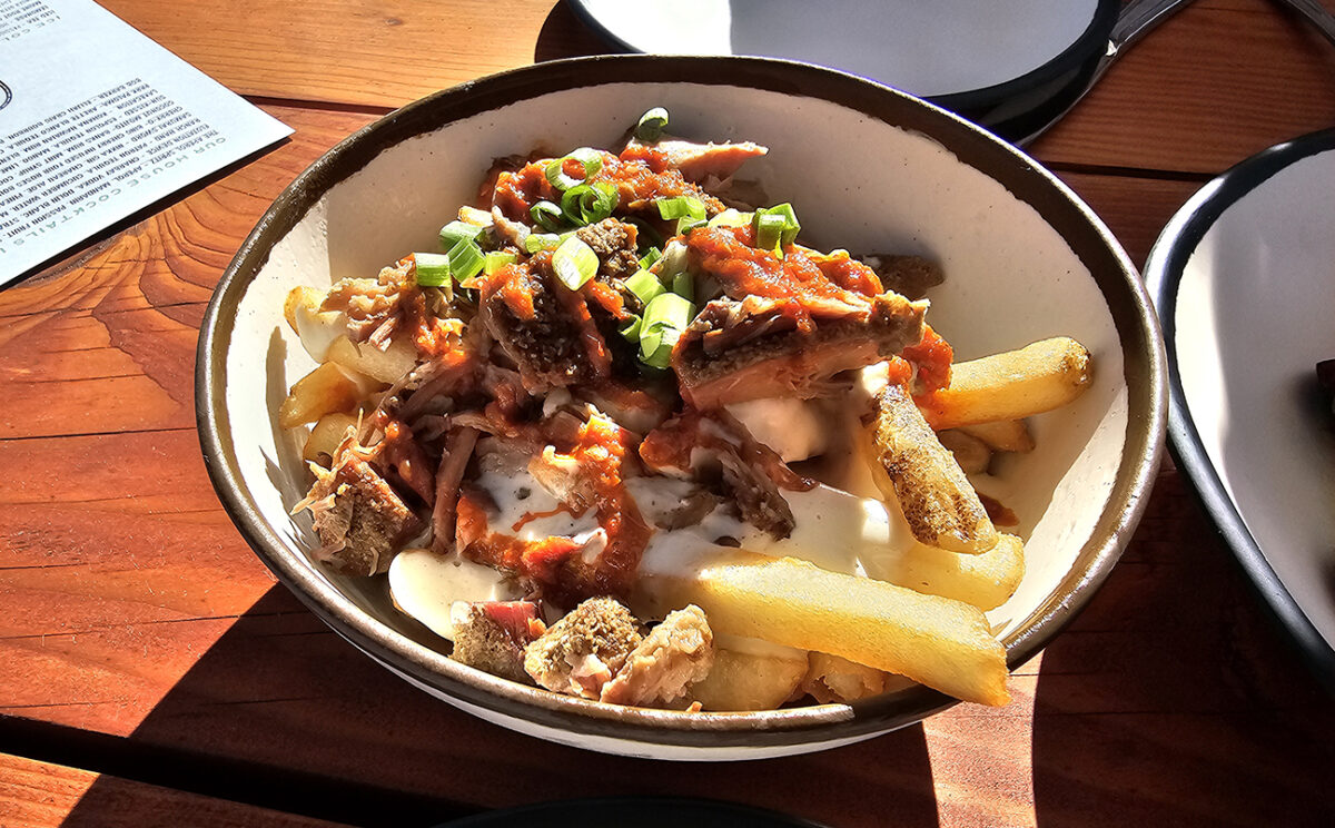Loaded fries with forever-cooked pork, cheese fondue and sparkle magic at The Waterhawk in Rohnert Park. (Heather Irwin/Sonoma Magazine)