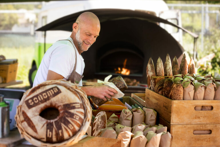 Mike Zakowski, owner and baker of The Bejkr, sells his bread, scones, and fresh wood-fired pretzels Friday, May 23, 2025 at the Sonoma Farmer’s Market. (John Burgess / The Press Democrat)
