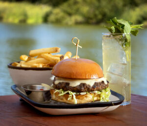 The Waterhawk Burger with cheese, iceberg, house sauce and B&B pickles from the Waterhawk Lake Club Thursday, August 14, 2025, in Rohnert Park. (John Burgess / The Press Democrat)