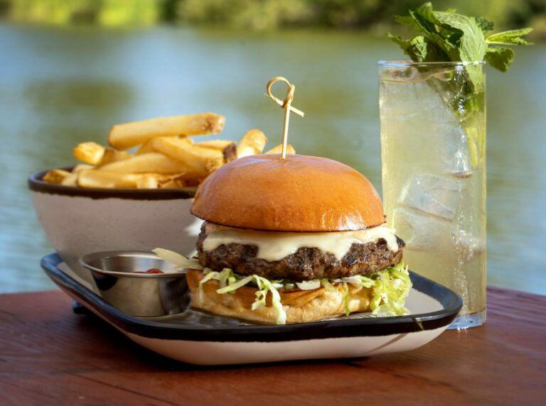 The Waterhawk Burger with cheese, iceberg, house sauce and B&B pickles from the Waterhawk Lake Club Thursday, August 14, 2025, in Rohnert Park. (John Burgess / The Press Democrat)