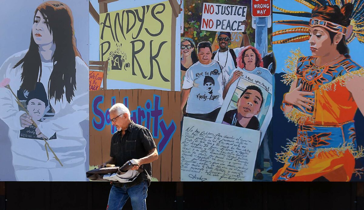 Artist Mario Uribe installed a new panel (no justice, no peace) on a mural at Andy's Park in Roseland, Tuesday August 1, 2017. The panel replaces an old panel, in which some in the community including the Lopez family say was to sympathetic to the Sonoma County sheriff's department. Andy Lopez was shot and killed by deputy Erick Gelhaus on October 22, 2013. (Kent Porter / Press Democrat) 2017
