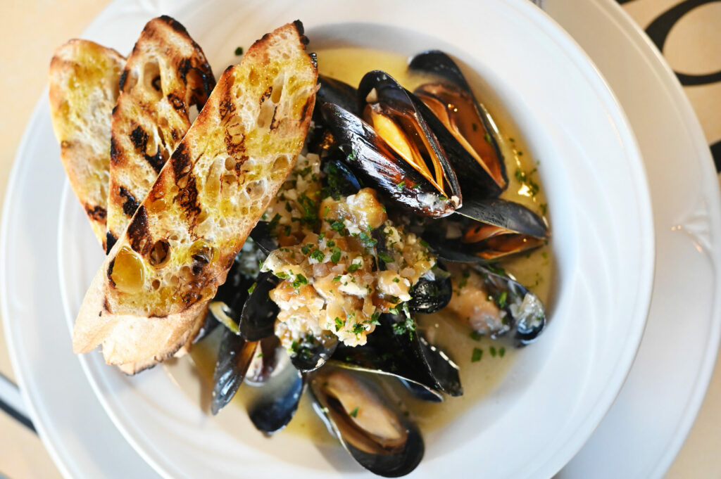 Mussels, white wine, garlic, shallots, caramelized onion and grilled bread; one the items on the Costeaux La Terrace bistro menu for the patio seating areaavailable starting at 4 p.m. Wednesday through Friday at the Costeaux French Bakery’s cafe in Healdsburg on Wednesday, July 31, 2024. (Erik Castro / For The Press Democrat)