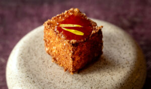 Dahlinho de Tapioca, fried bite with aged gouda, parmigiana and chili jam from the new prix fixe tasting menu at The Lodge at Dawn Ranch Thursday, September 4, 2025 in Guerneville. (John Burgess / The Press Democrat)