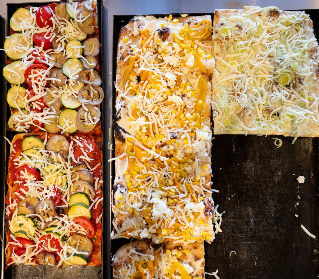 Roman-style sourdough pizzas are cut to length and sold by weight Thursday, September 25, 2025 at Psychic Pie in Sebastopol. (John Burgess / The Press Democrat)