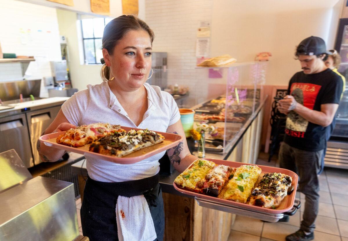 Co-owner Leith Leiser Miller serves up Roman-style sourdough pizzas Thursday, September 25, 2025 at Psychic Pie in Sebastopol. (John Burgess / The Press Democrat)