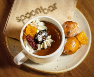 Dark Chocolate Pot de Créme with candied orange, ricotta donut and chantilly from Spoonbar Thursday, June 5, 2025 in Healdsburg. (John Burgess / The Press Democrat)