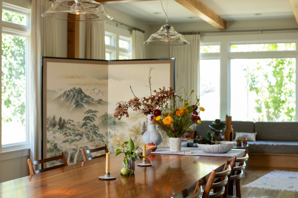 A custom-made walnut dining table is the centerpiece of the open-plan dining and living space. Even during the busy harvest season, the Hobbs family makes a point to sit down to dinner together at the table each night. (Eileen Roche / for Sonoma Magazine)