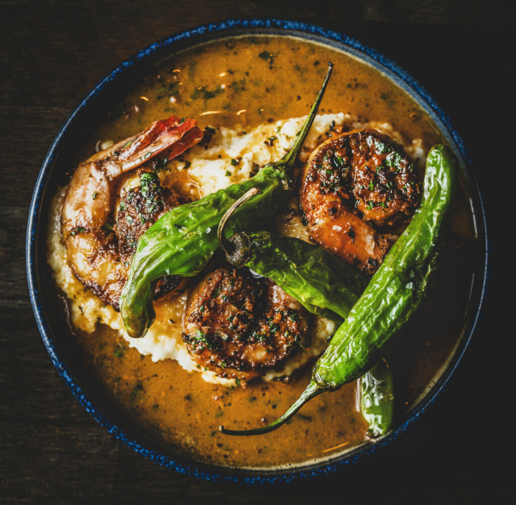 Shrimp and Grits with blackened prawns, cheddar grits, fried shishito peppers at the Grove Speakeasy Thursday, Oct. 9, 2025 in Penngrove. (John Burgess / The Press Democrat)