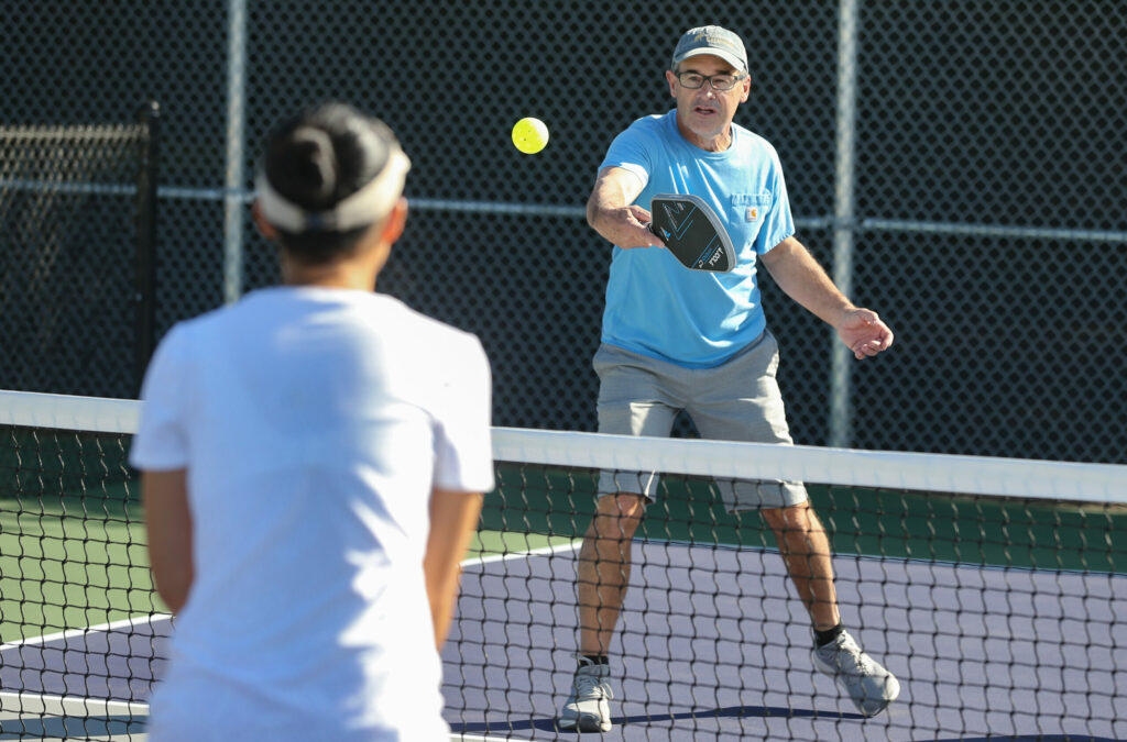 Ross Albertson hits a volley while playing pickleball on the newly opened courts at Hiram Lewis Park in Windsor on Friday, October 4, 2024. (Christopher Chung / The Press Democrat)