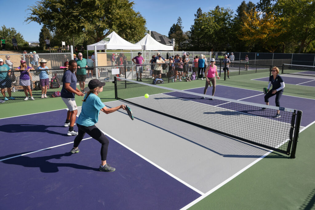 Shiva Gaskins, left, and Lisa Buckner take on Erin Byrn and Mary Terbush in a match on the newly opened pickleball courts Hiram Lewis Park in Windsor on Friday, October 4, 2024. (Christopher Chung / The Press Democrat)