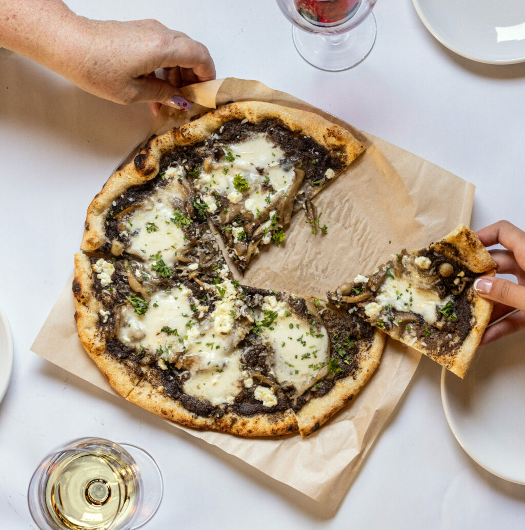 Mushroom Pizza with fresh local mushrooms, mozzarella, feta, truffle oil and parsley from Hazel restaurant Thursday, July 10, 2025 celebrating 10 years in Occidental. (John Burgess / Press Democrat)