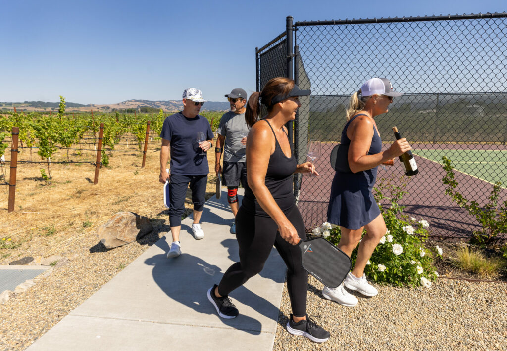 Mia Steiger brought her pickleball group for a one of a kind experience amongst the vineyard at Anaba Winery Thursday, July 10, in Sonoma. (John Burgess / The Press Democrat)