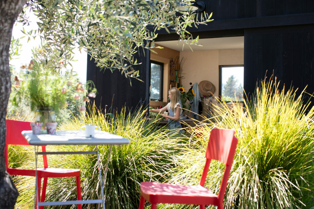 The two-story potting shed in the family's garden provides plenty of space for garden tools and a crafts room where Cristina Hobbs and her daughters spend many happy hours creating and sewing. (Eileen Roche / for Sonoma Magazine)