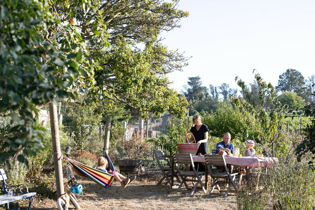 The Nichols family enjoys a sunny autumn day in their garden. (Eileen Roche / for Sonoma Magazine)