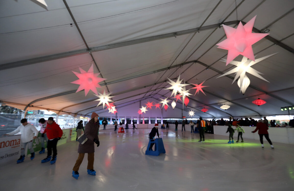 People skate for the first time at the opening of Luma Ice, the city's first-ever holiday ice skating rink, at the Petaluma Fairgrounds, Friday, December 13, 2024. (Darryl Bush / For The Press Democrat)