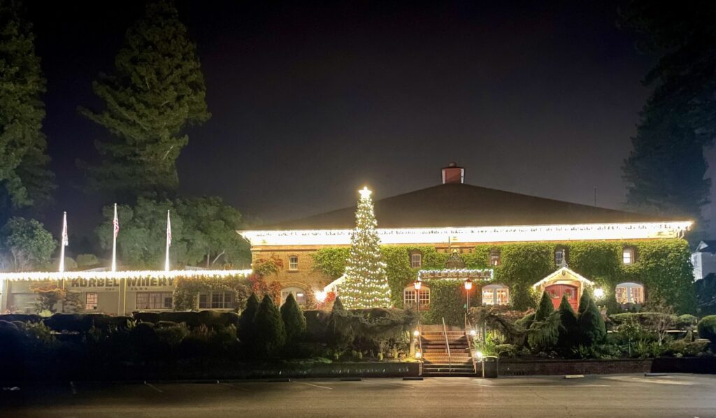 A 25-foot Christmas tree wrapped in lights stands in front of Korbel Champagne Cellars in Guerneville. (Korbel Champagne Cellars)
