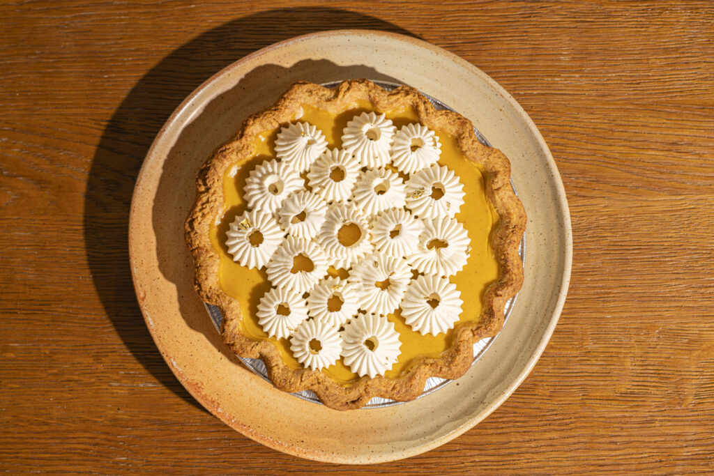 A pumpkin pie topped with whipped vanilla bean cream from the Thanksgiving menu at Little Saint in Healdsburg. (Emma K Creative)