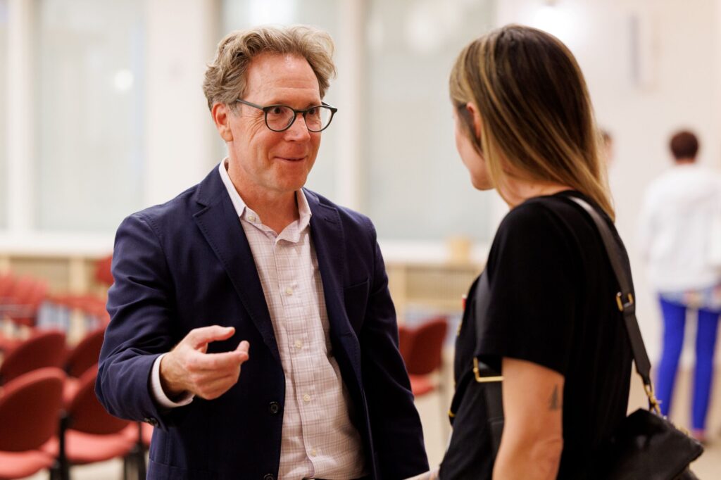 Rabbi Jeremy Morrison talks to a member of the community after Shabbat at Congregation Shomrei Torah on August 15, 2025. (Abraham Fuentes/For The Press Democrat)