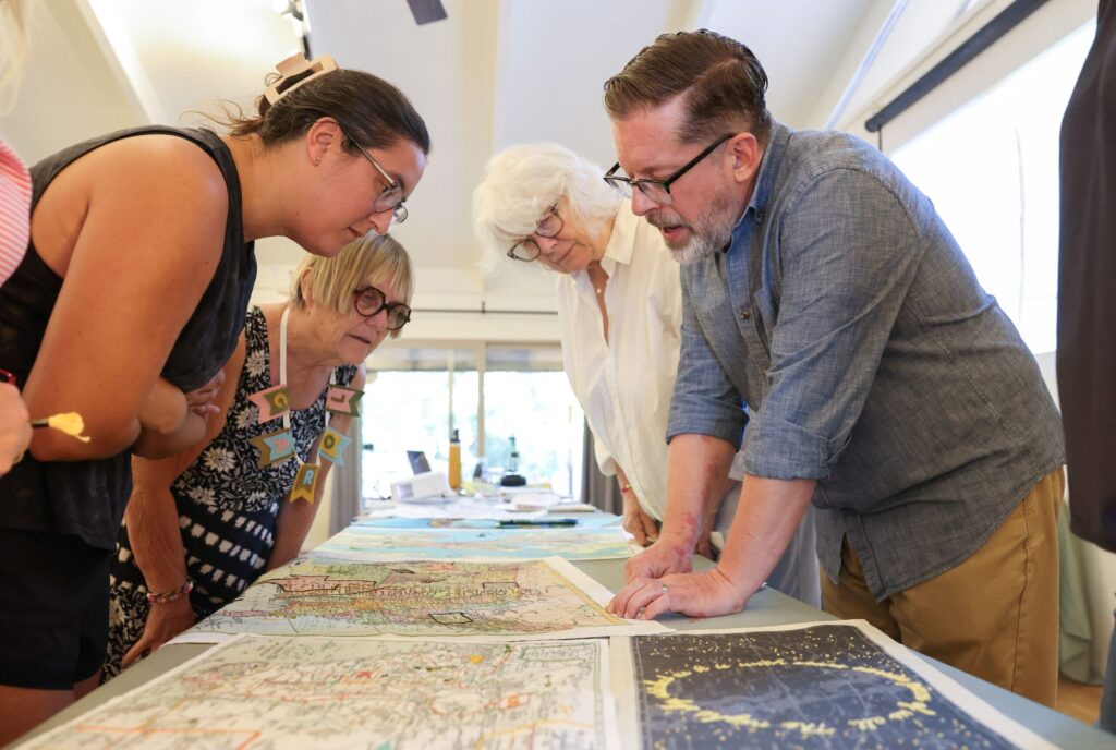 Robert Mahar talks to students about the types of embroidery stitches can be useful while embroidering maps during his craft retreat at Westerbeke Ranch in Sonoma on Tuesday, September 16, 2025. (Christopher Chung/The Press Democrat)