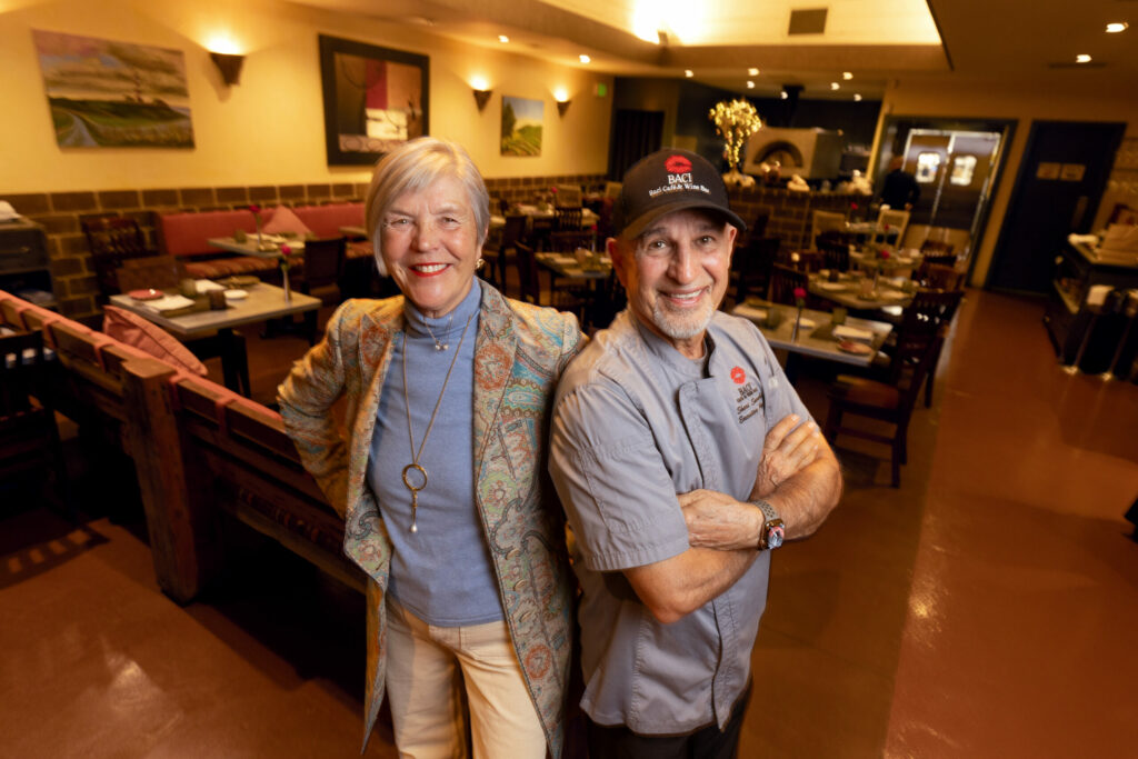 Lisbeth Holmefjord runs the front of the house while co-owner/husband/chef Shari Sarabi runs the large kitchen at Baci Cafe and Wine Bar Thursday, Oct. 16, 2025 in Healdsburg. (John Burgess / The Press Democrat)