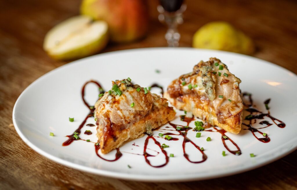 Caramelized Organic Pear Tartlets with Pt. Reyes blue cheese, pear brandy compote, cali port reduction and puff pastry at the Sonoma Wine Shop/La Bodega Kitchen Thursday, Nov. 13, 2025 in Sebastopol. (John Burgess / The Press Democrat)