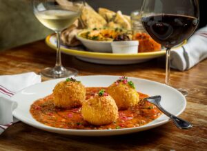 Saffron & Rose Petal Arancini with rice, mozzarella, butter, marinara, shallots, garlic, chives and panko at the Sonoma Wine Shop/La Bodega Kitchen Thursday, Nov. 13, 2025 in Sebastopol. (John Burgess / The Press Democrat)