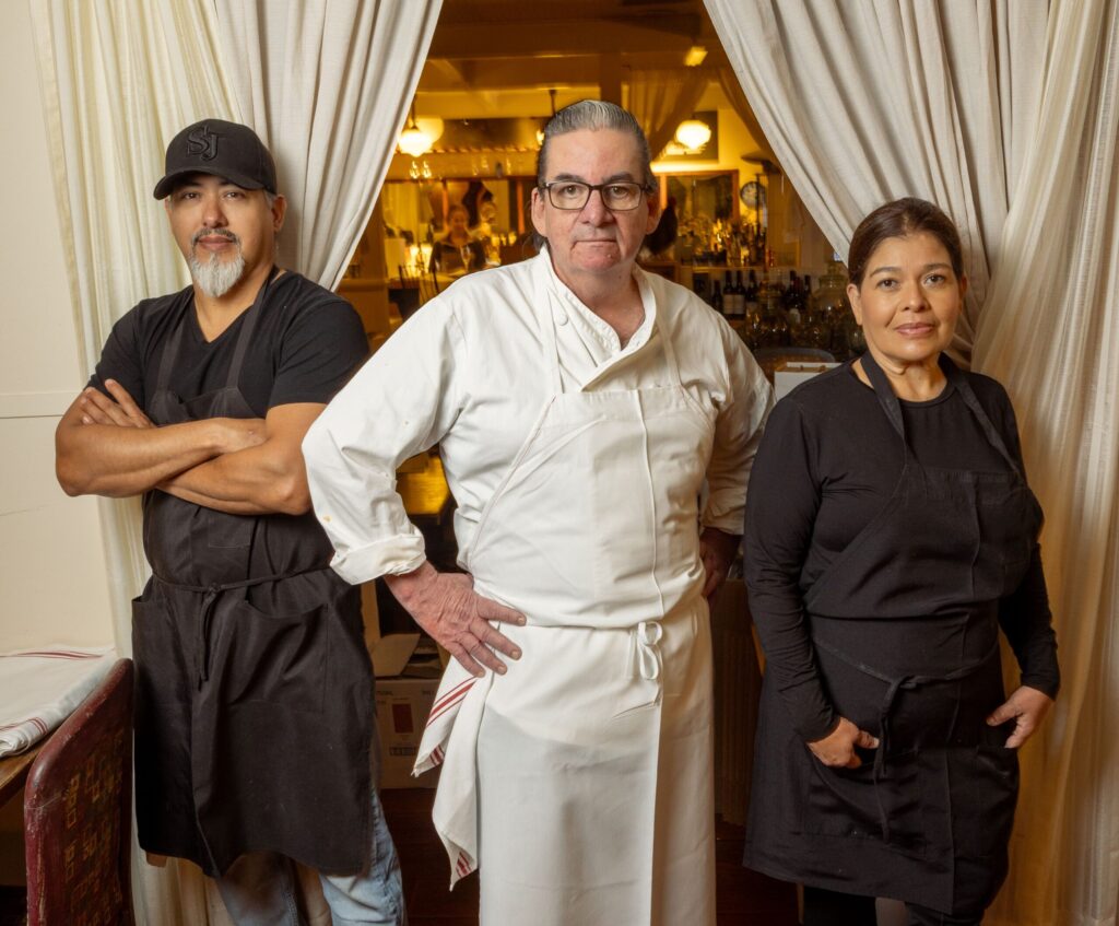 Chef Rick Vargas, center, with Jose Leopoldo Cruz Vargas and Maria Davalos Sanchez at the Sonoma Wine Shop/La Bodega Kitchen Thursday, Nov. 13, 2025, in Sebastopol. (John Burgess / The Press Democrat)