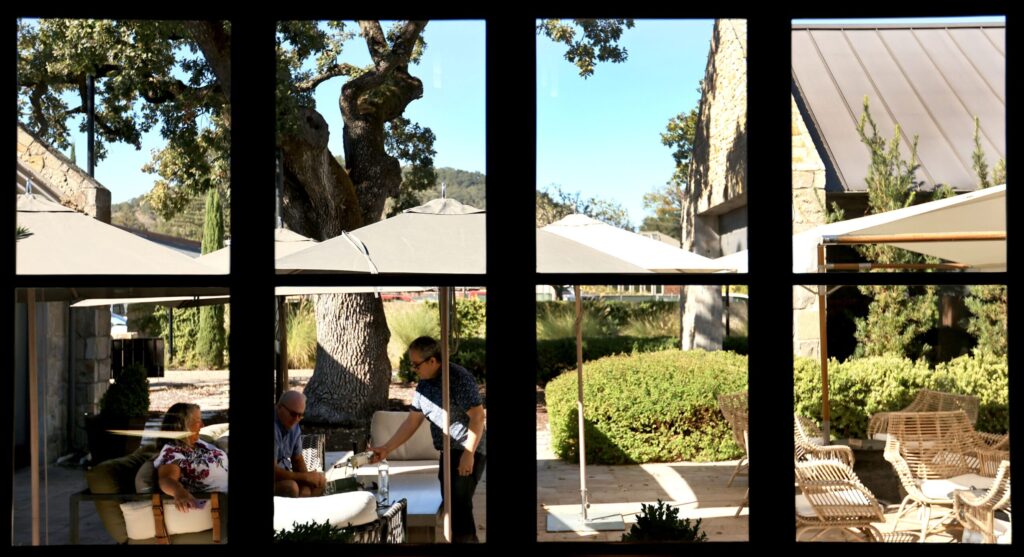 Wine ambassador Manny Lopez pops a flight of wine at Stewart Cellars, Friday, October 21, 2025, in Yountville. (Kent Porter / The Press Democrat)