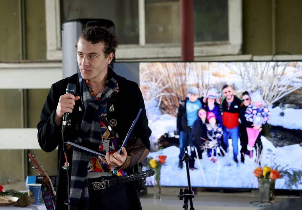 Seth Pringle, son of Katranne Pringle, reads a poem in honor of his late mother during a celebration of life event for her at Tolay Lake Regional Park in Petaluma Sunday, March 30, 2025. (Beth Schlanker / The Press Democrat) 