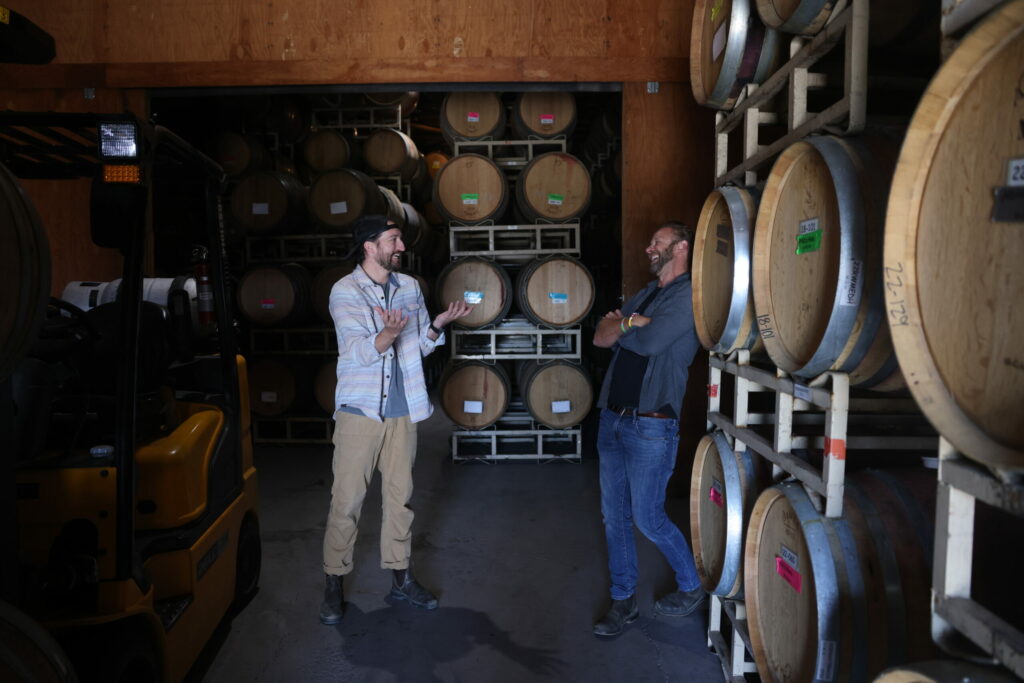Tyler Hayes and Ross Reedy of Right Turn Wine Co. share a laugh in the cellar. (Beth Schlanker / for Sonoma Magazine)